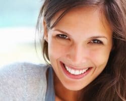a woman smiling - cosmetic dentistry
