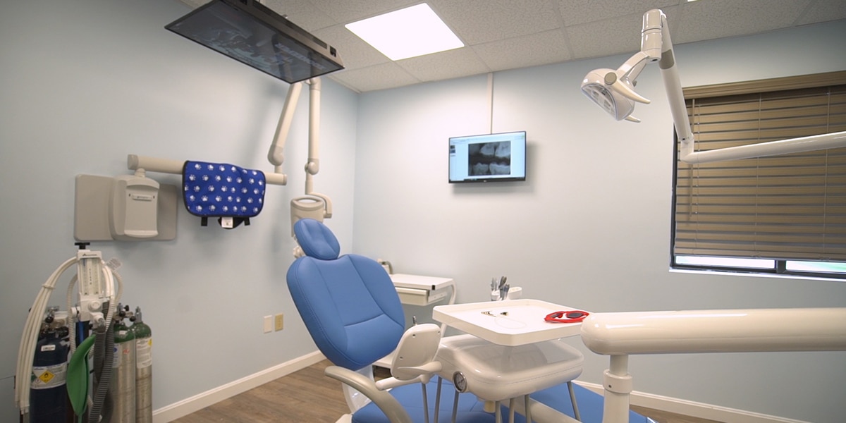 dental exam room with blue chair and light blue walls