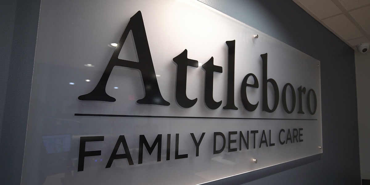 Attleboro Family Dental Care glass wall plaque